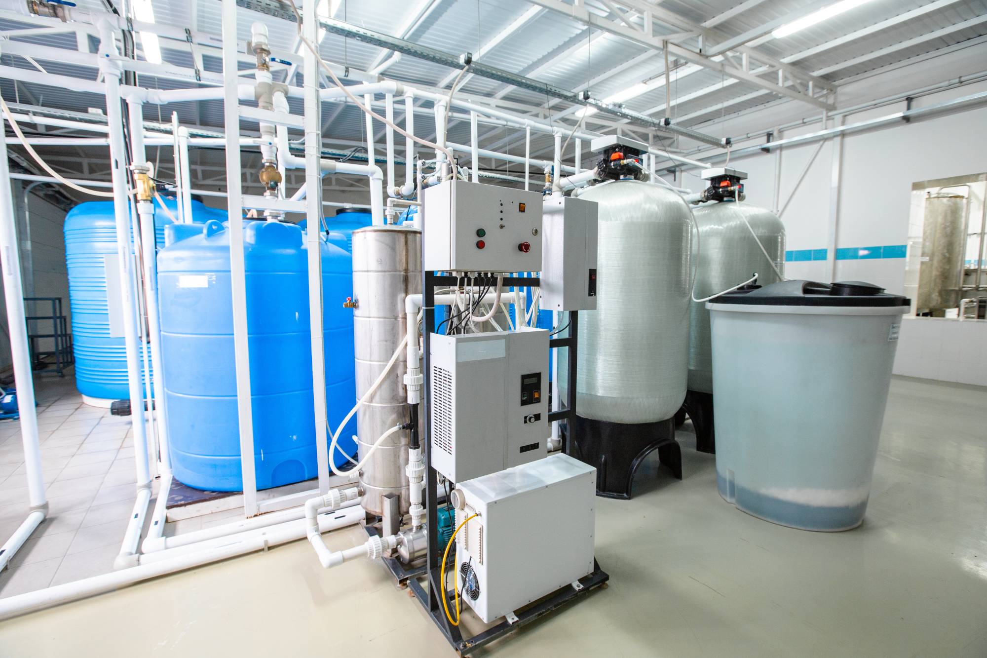 Industrial water treatment facility featuring large storage tanks and advanced filtration systems